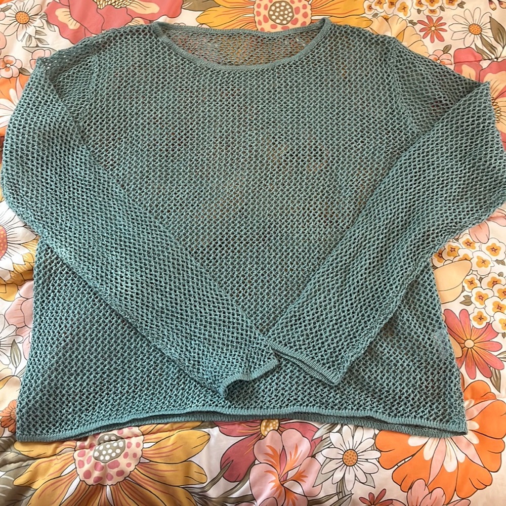 Fishnet can be used as a  bathing, suit cover-up or normal day sweater.